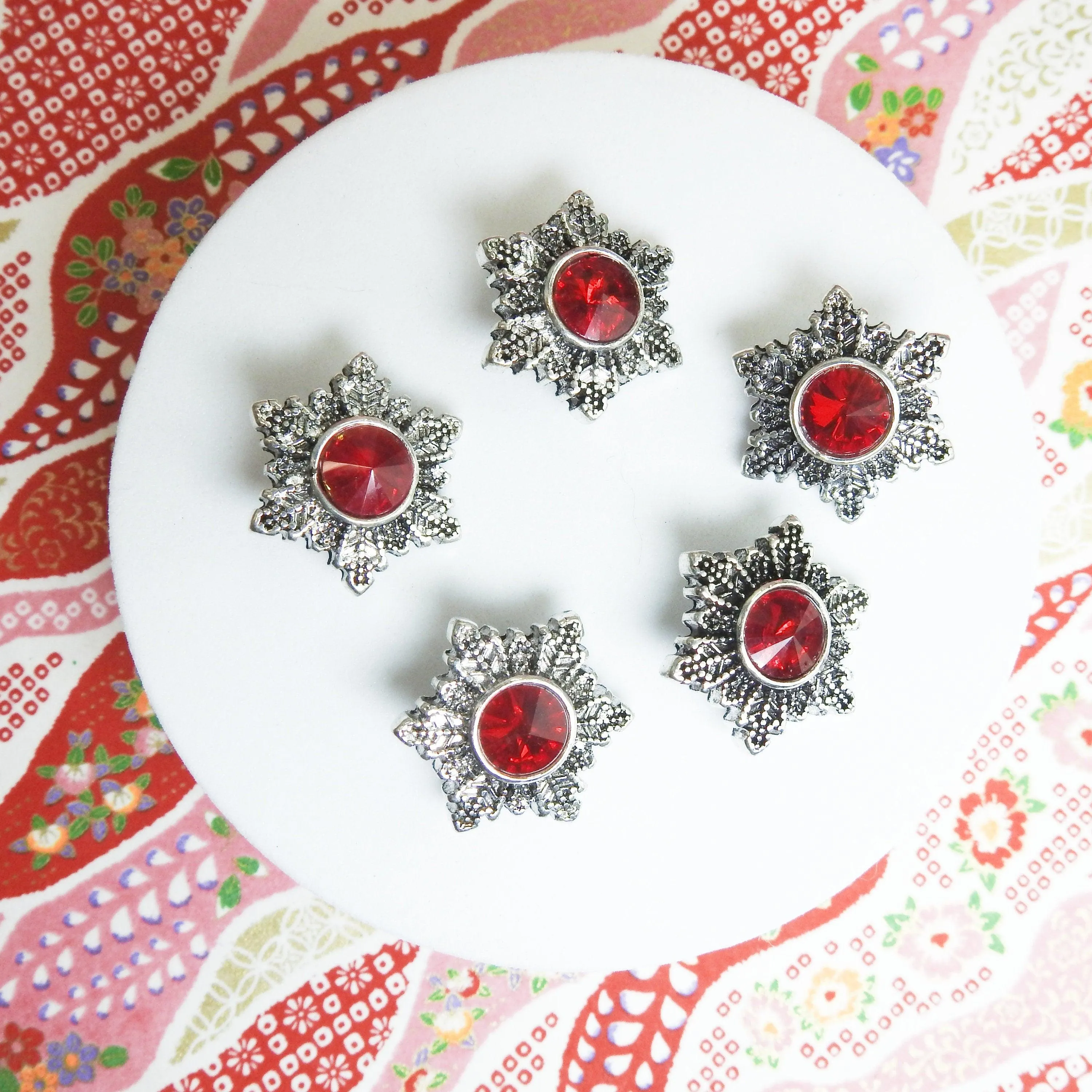 Red snowflake snap buttons